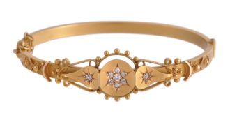 A 15 carat gold and diamond hinged bangle A 15 carat gold and diamond hinged bangle, the central