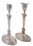 A pair of late Edwardian silver candlesticks, maker`s mark `F A pair of late Edwardian silver