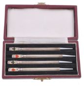 A cased set four silver coloured bridge propelling pencils , stamped A cased set four silver