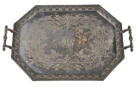 An electro-plated octagonal tray, with twin masked handles, a beaded border An electro-plated