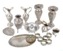 A quantity of silver coloured items, to include; a pair of silver coloured... A quantity of silver