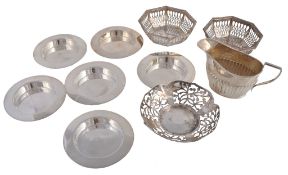 A set of six Edwardian silver circular ash trays by Hukin & Heath A set of six Edwardian silver