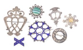 A collection of silver brooches, to include A collection of silver brooches, to include: two