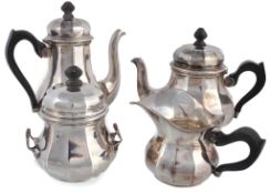 A silver coloured facetted baluster four piece tea service, stamped €0` A silver coloured facetted