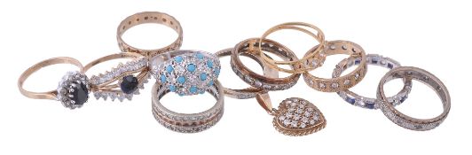 Eleven costume rings, including: a blue and white stone set ring Eleven costume rings, including: