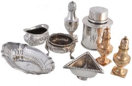 A collection of silver items, to include: a silver cylindrical canister by... A collection of silver