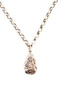 A gold coloured nugget pendant, set with old cut diamonds A gold coloured nugget pendant, set with