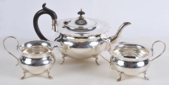 A silver three piece circular baluster tea service by Kemp Brothers A silver three piece circular