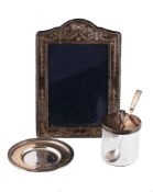 A silver mounted shaped rectangular photo frame by Carr`s of Sheffield Ltd A silver mounted shaped