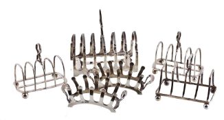 A pair of silver four division toast racks by Thomas Bradbury & Sons Ltd A pair of silver four