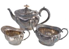 A late Victorian silver three piece tea service by Hawksworth, Eyre & Co. Ltd A late Victorian