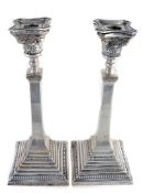 A pair of silver candlesticks by Britton, Gould & Co A pair of silver candlesticks by Britton, Gould