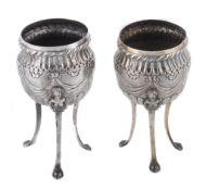 A pair of Continental silver coloured urns, with a cable twist border A pair of Continental silver