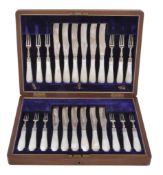 A cased set of twelve Edwardian matched silver dessert knives and forks by... A cased set of
