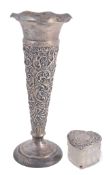 A silver embossed spill vase by William Comyns & Sons, London 1910 A silver embossed spill vase by