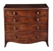A George III mahogany bowfront chest of drawers, circa 1790, the top with a reeded edge above four