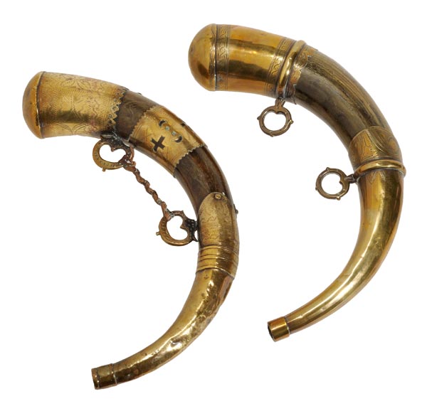 Two similar horn and brass mounted powder flasks, 19th century, each with a domed cover above