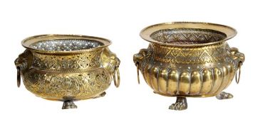 Two Dutch repousse worked brass jardinieres in 17th century style, late 19th century, each with twin