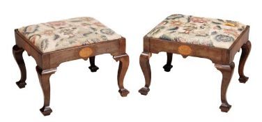 A pair of George II red walnut and marquetry decorated stools, circa 1750, each needlework drop-in