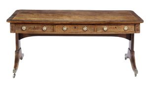 A Regency mahogany and rosewood crossbanded library table, circa 1815, the rectangular top with