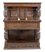 A Charles I oak livery cupboard, circa 1630, Yorkshire, possibly Leeds area, carved throughout