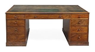 A William IV mahogany partners pedestal desk, circa 1835, the moulded rectangular top with gilt