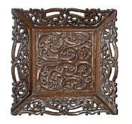 An oak tray incorporating a mid 17th century panel, the frame 19th century, carved throughout with