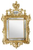 A Continental carved giltwood and etched glass wall mirror, late 18th/ early 19th century, the