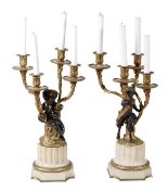 A pair of French patinated and gilt bronze and marble mounted four light candelabra, circa 1875,