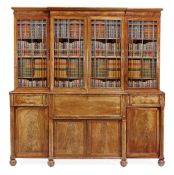 A George IV mahogany breakfront secretaire bookcase, circa 1825, in the manner of Gillows of