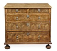 A William and Mary walnut oyster veneered chest of drawers, circa 1690, the rectangular top with