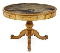 A Victorian satinwood drum library table, circa 1860 in the manner of Holland & Sons, the circular