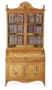 A Victorian satinwood bureau bookcase, circa 1860 crossbanded in rosewood with borders of inlaid