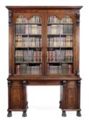 A Regency mahogany library bookcase, circa 1815, attributed to Gillows of Lancaster, the moulded