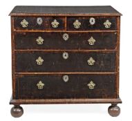 A William and Mary oyster laburnum chest of drawers, circa 1690, the rectangular top with