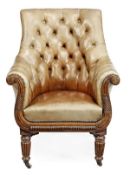A Regency mahogany and leather upholstered library armchair, circa 1815, the arched padded back,