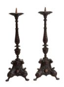 A pair of Italian carved and stained wood altar pricket candlesticks, 18th century, each with dished