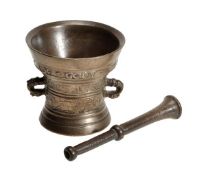 A Flemish bronze or bell metal mortar, dated 1635, with flared rim above script cast in low