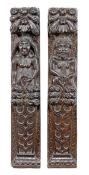 A pair of James I carved oak term figures, circa 1610, depicting a male and female figure