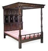 An oak tester bed, 17th century and later elements, the panelled canopy above a multiple field