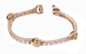 A 9 carat gold bracelet, with engraved detail and set with round cut cubic... A 9 carat gold