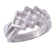 An 18 carat gold diamond ring, set with ten Princess cut diamonds in a... An 18 carat gold diamond