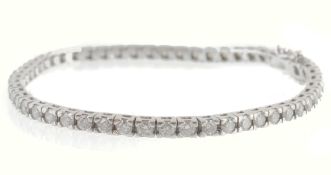 A diamond line bracelet, the articulated bracelet set with brilliant cut... A diamond line