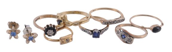 A sapphire ring, the central oval cut sapphire in a four claw setting A sapphire ring, the central