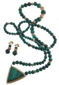 A malachite bead necklace, the graduated malachite beads with gilt metal... A malachite bead