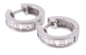 A pair of diamond set ear hoops, the ear hoops set with baguette cut... A pair of diamond set ear