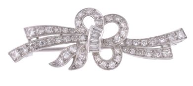 A diamond ribbon bow brooch, set throughout with baguette cut and eight cut... A diamond ribbon bow