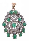 An emerald and diamond pendant, the pierced scrolled pendant set with... An emerald and diamond