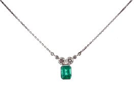 An emerald and diamond pendant, the rectangular step cut emerald in a collet... An emerald and