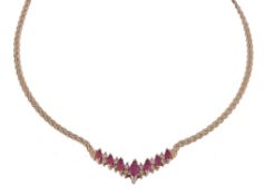 A ruby and diamond necklace, the front panel set with marquise cut rubies... A ruby and diamond